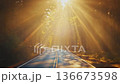 Ethereal Forest Road with Dramatic Golden Sun Rays and Morning Mist 136673598