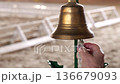 Judge ringing bronze bell at equestrian competition indoor 4K 136679093