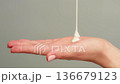 Woman apply cream for hands skin, Close-up of hands with exfoliating cream, demonstrating effective 136679123
