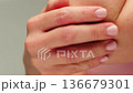 Woman apply cream for hands skin, Close-up of hands with exfoliating cream, demonstrating effective 136679301