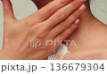 Woman apply cream for hands skin, Close-up of hands with exfoliating cream, demonstrating effective 136679304