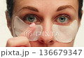 Woman apply cream for hands skin, Close-up of hands with exfoliating cream, demonstrating effective 136679347