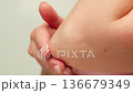 Woman apply cream for hands skin, Close-up of hands with exfoliating cream, demonstrating effective 136679349