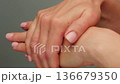 Woman apply cream for hands skin, Close-up of hands with exfoliating cream, demonstrating effective 136679350