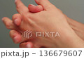 Woman apply cream for hands skin, Close-up of hands with exfoliating cream, demonstrating effective 136679607