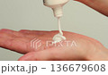 Woman apply cream for hands skin, Close-up of hands with exfoliating cream, demonstrating effective 136679608