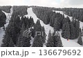 Travel and winter adventure concept. Aerial view of the ski resort. Kopaonik National Park, winter landscape in the mountains, coniferous forest covered with snow 136679692