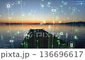 Dock At Sunset With Floating Digital Icons, Tranquil Water Reflections And Warm Sky Interlaced With Energy 136696617