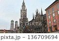 Munich, germany, december 27, 2025. Iconic view of the new town hall and frauenkirche on a cloudy day at marienplatz, ce 136709694
