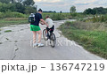 Happy family cycling at a countryside 136747219