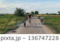 Happy family cycling at a countryside 136747228