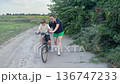 Happy family cycling at a countryside 136747233