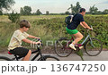 Happy family cycling at a countryside 136747250
