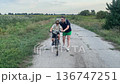 Happy family cycling at a countryside 136747251