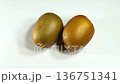 Two whole golden kiwi fruits isolated on white background 136751341