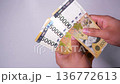Video of counting Korean banknotes by hand 136772613