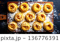 Overhead shot of pasta rows on wooden surface, ambient light, flour dust, handmade texture 136776391