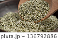 Wooden spoon with legal alimentary hemp seeds in rustic bowl close up 136792886