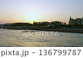Mediterranean coast at sunset with calm sea water pier and seaside city skyline 136799787