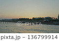 Mediterranean sea coastal city skyline at sunset with long pier and calm water 136799914