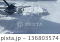 Snow Removal Visualization. Methodical Snow Shoveling Creating Small Snow Heaps Under Winter Light 136803574