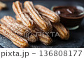 Delicious Churros with Chocolate Dip Ready for Enjoyment 136808177