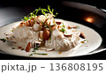 Delicious Creamy Fish Dish Topped With Almonds and Fresh Herbs 136808195