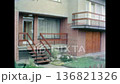 Modern residential buildings entrances with stylish front door, clean facade in spring. Contemporary house exterior featuring design in urban street. Old film. Archival retro 1970s. Vintage archive 136821326