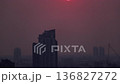 Time-lapse of the sun setting over the capital city of Bangkok, creating a dramatic urban skyline scene 136827272
