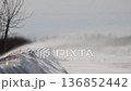 Chilly cold landscape with snow. High wind carrying snow particles 136852442