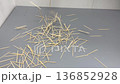 Wooden toothpicks dropping, knocking onto the MDF 136852928