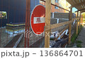 Construction site with no entry sign near a building in a busy area during the day 136864701