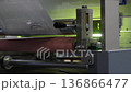 High resolution Industry printer close up. Industrial inkjet printer in operation. printing pattern on large sheet of fabric or paper. Automate printer for modern printing and digital print technology 136866477