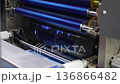 High resolution Industry printer close up. Industrial inkjet printer in operation. printing pattern on large sheet of fabric or paper. Automate printer for modern printing and digital print technology 136866482