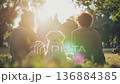 Happy family with dog sitting in the park at sunset. 136884385