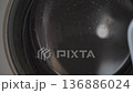 Clothes Spinning in a Washing Machine Drum During a Wash Cycle 136886024