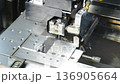 Sparks from an electric discharge machine during processing 136905664