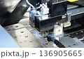 Sparks from an electric discharge machine during processing 136905665