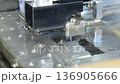 Sparks from an electric discharge machine during processing 136905666