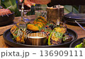 prick a piece of pumpkin with a fork Grilled vegetables platter 136909111