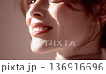 Smiling close-up: Showing feminine confidence and natural beauty 136916696