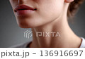 Close-up view of a woman's delicate chin and lips 136916697