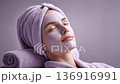 Woman relaxing with purple facial mask 136916991