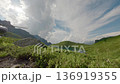 Mountain valley lake with taking off helicopter aerial follow view 136919355