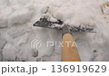 Pov Shovel Clearing Snow On Driveway, Wooden Handle Pushing Heavy Powder Into Pile, Closeup Overhead Reveal 136919629