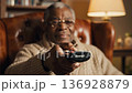 Elderly african american man pushing restart button 136928879