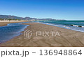Mediterranean coast on a sunny day in winter. Waves of breeze on a sandy beach. Spain, Castellon de la Plana 136948864