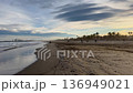 Mediterranean coast on a sunny day in winter. Waves of breeze on a sandy beach. Spain, Castellon de la Plana 136949021