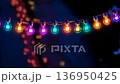 Color-changing LED bulbs pulsing rhythmically against a vibrant backdrop at a festive gathering 136950425