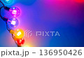 Color-changing LED bulbs pulsing rhythmically against a vibrant backdrop at a festive gathering 136950426